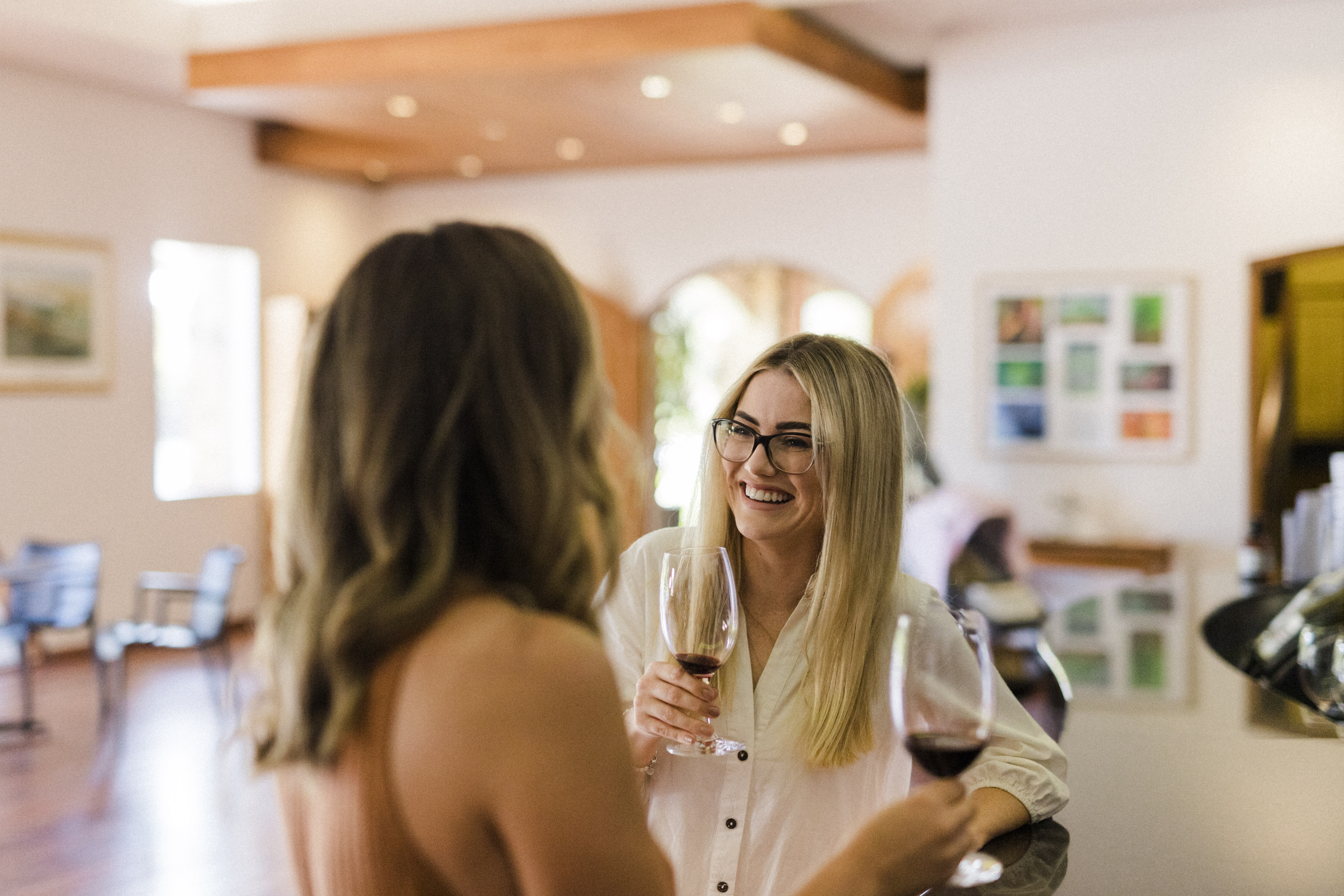 Two women drinking wine at tasting room